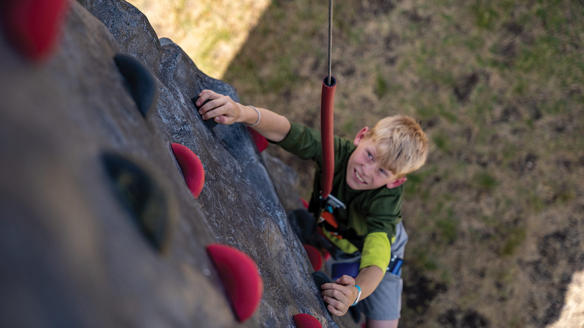 Child climbing rock wall at Solitude Adventure Park