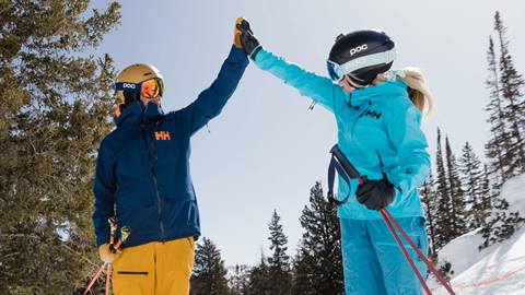 High-fiving skiers at Solitude Mountain Resort