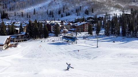 Snowboarding down to lodging at Solitude Mountain Resort
