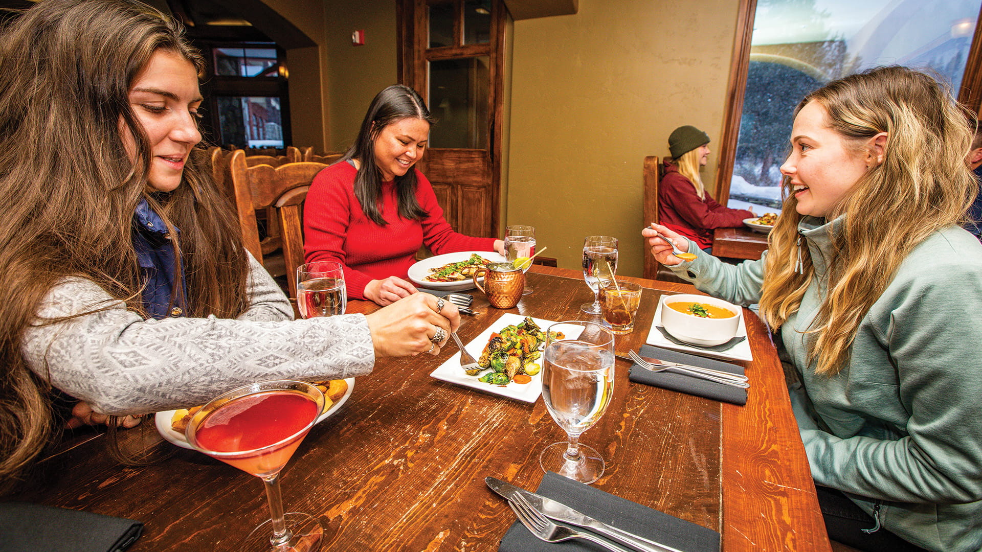 three friends starting their meal at Honeycomb Grill