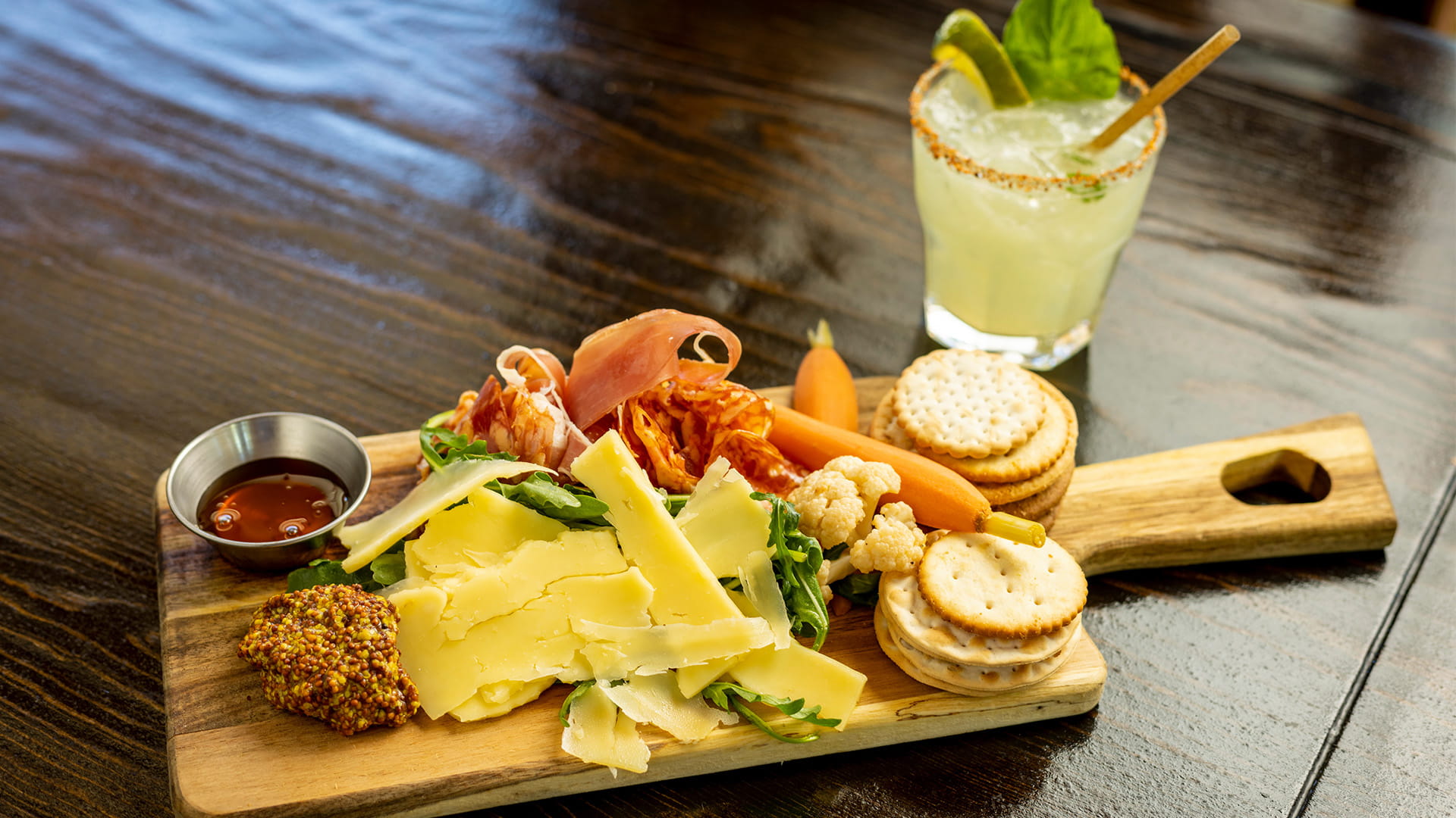 Charcuterie plate and a cocktail at Honeycomb Grill at Solitude Mountain Resort