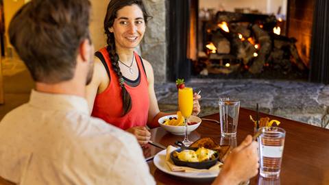 A couple enjoying brunch at St. Bernard's at Solitude Mountain Resort