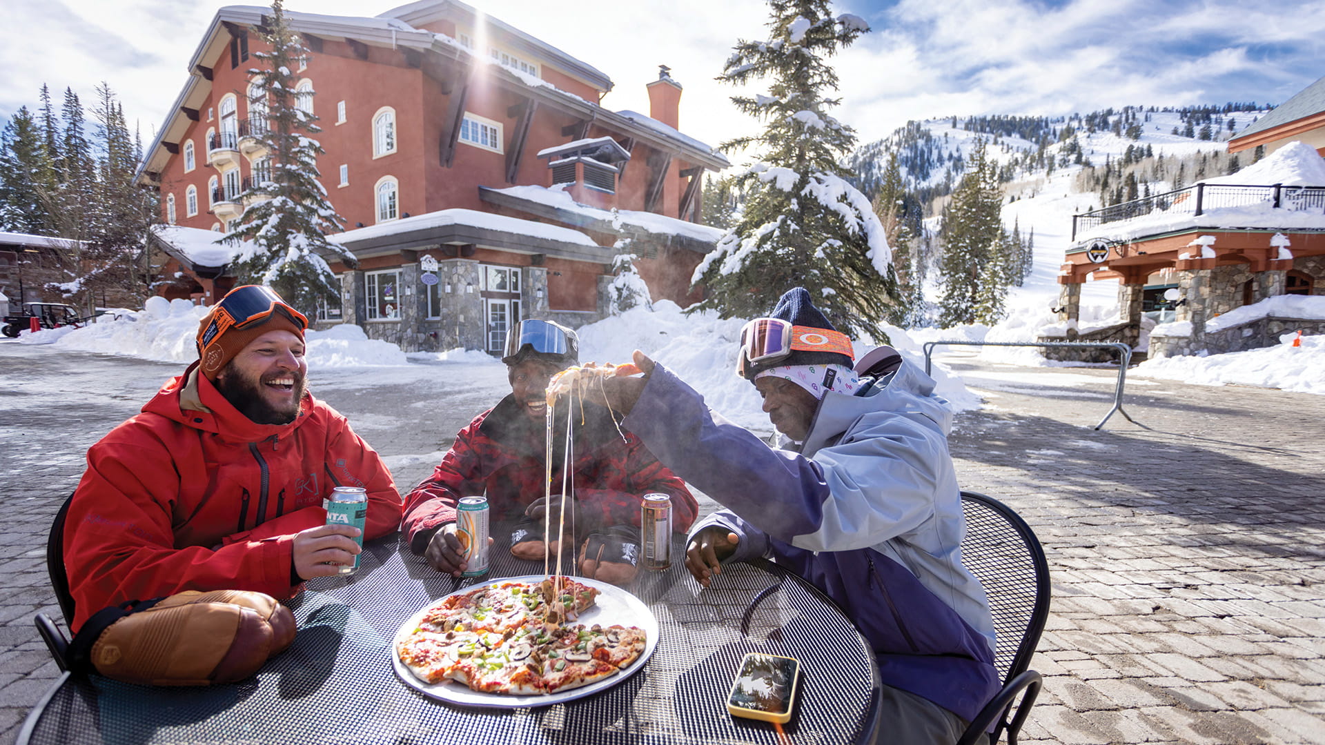 Three friends enjoying a pizza at Stone Haus