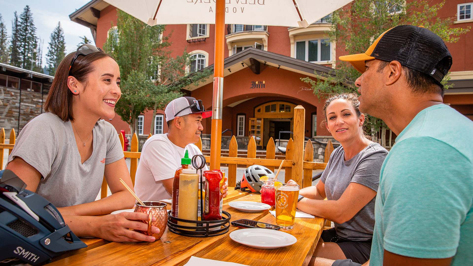 Friends enjoying drinks on the patio at The Thirsty Squirrel