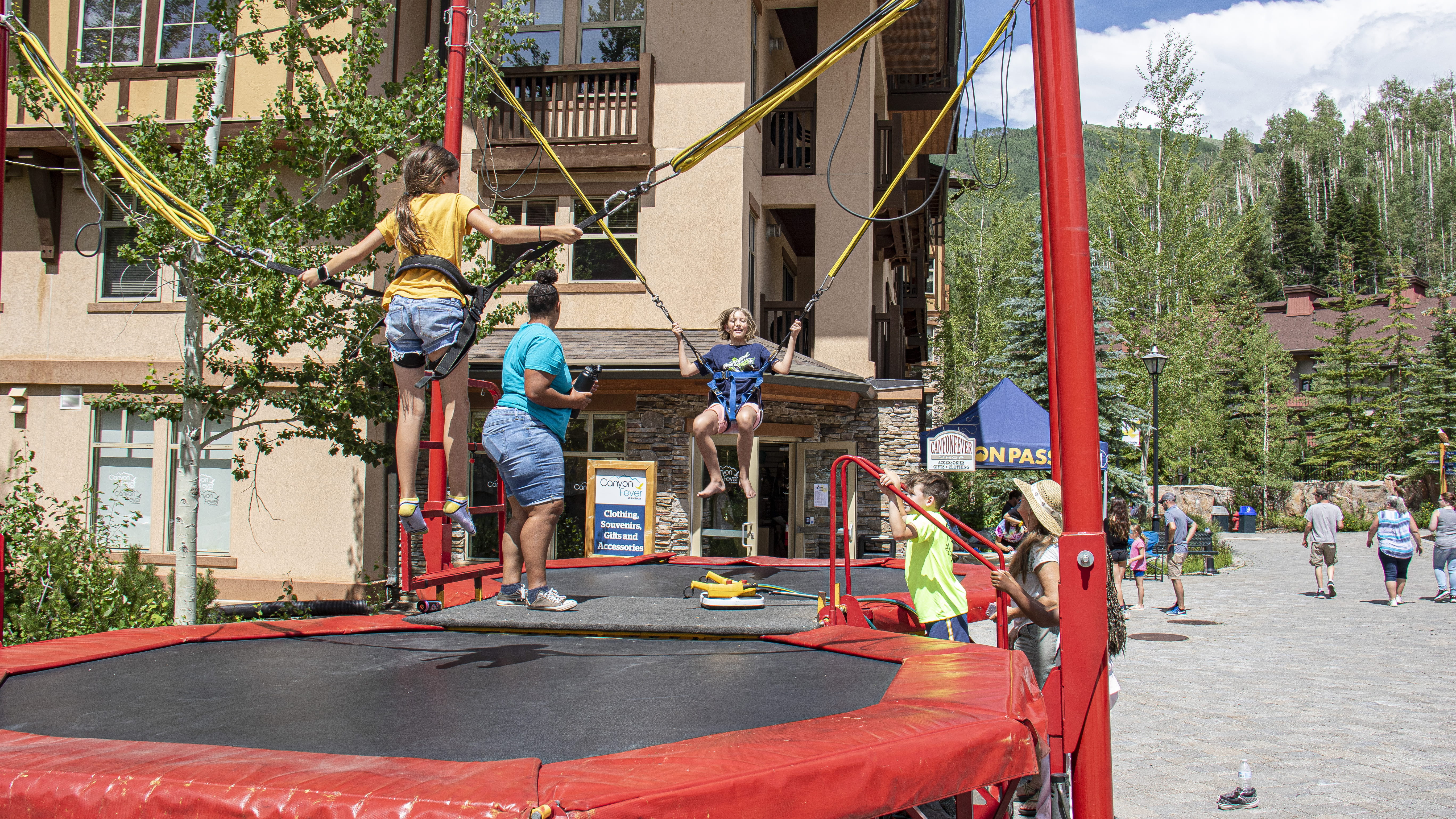 Kids jump on trampoline at summerfest 