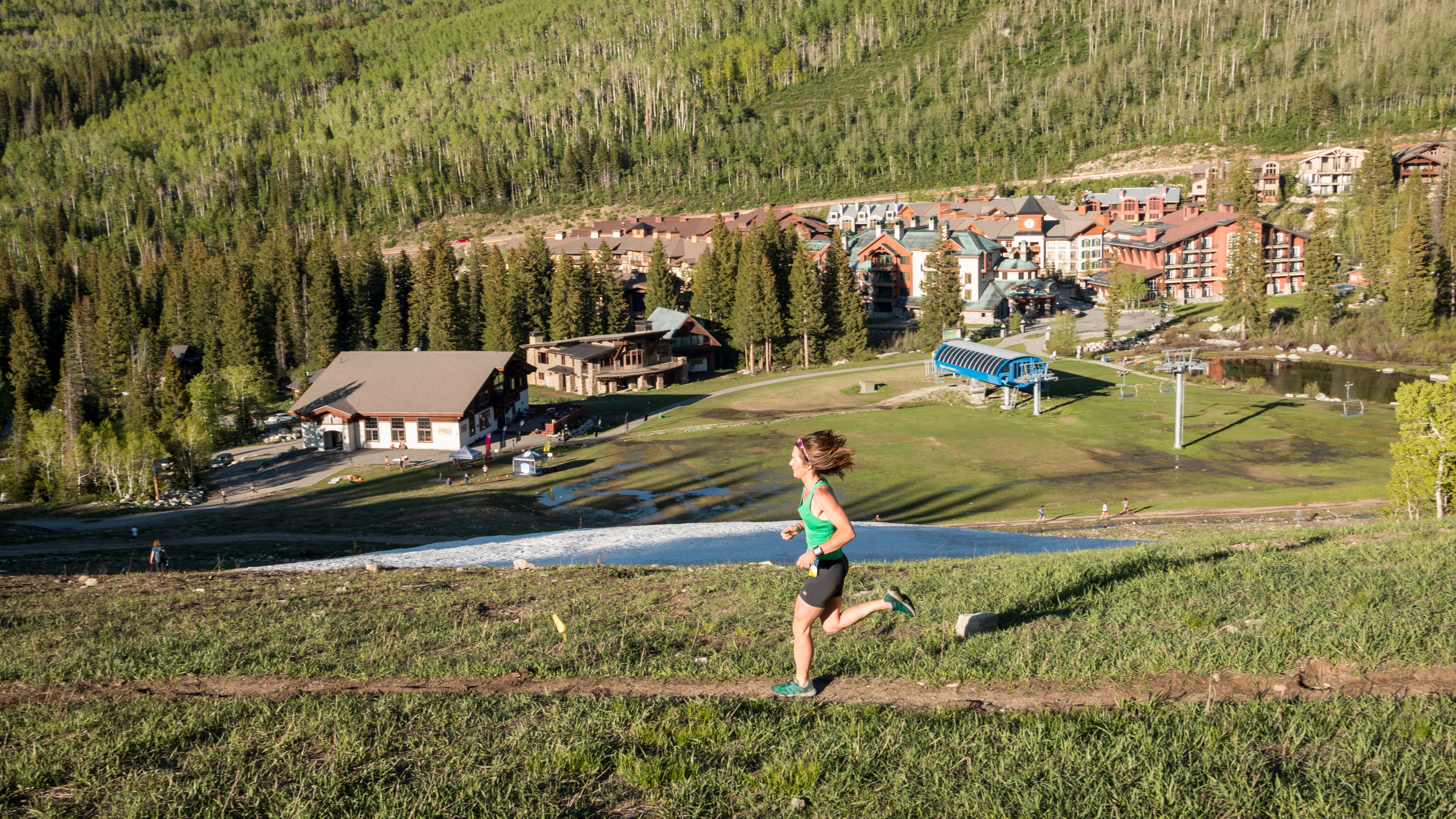 Person runs at Solitude Mountain Resort for the Wasatch Trail Run Series