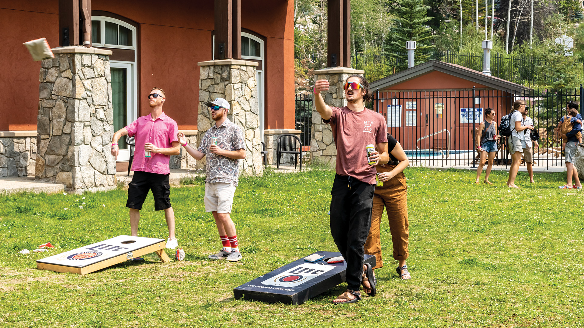Friends playing Cornhole at Solitude.