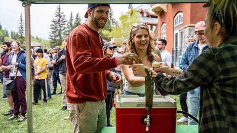 A couple getting a drink at Big Cottonwood Brew Fest at Solitude Mountain Resort