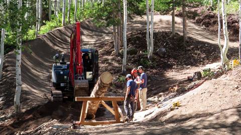 Employees work to build a feature in Solitude Bike Park 