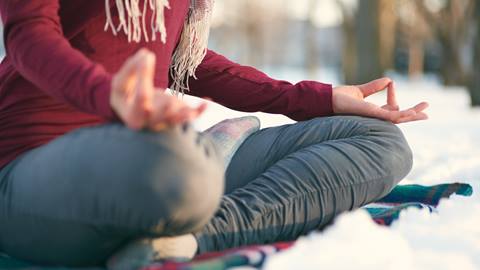Woman in a yoga pose outdoors