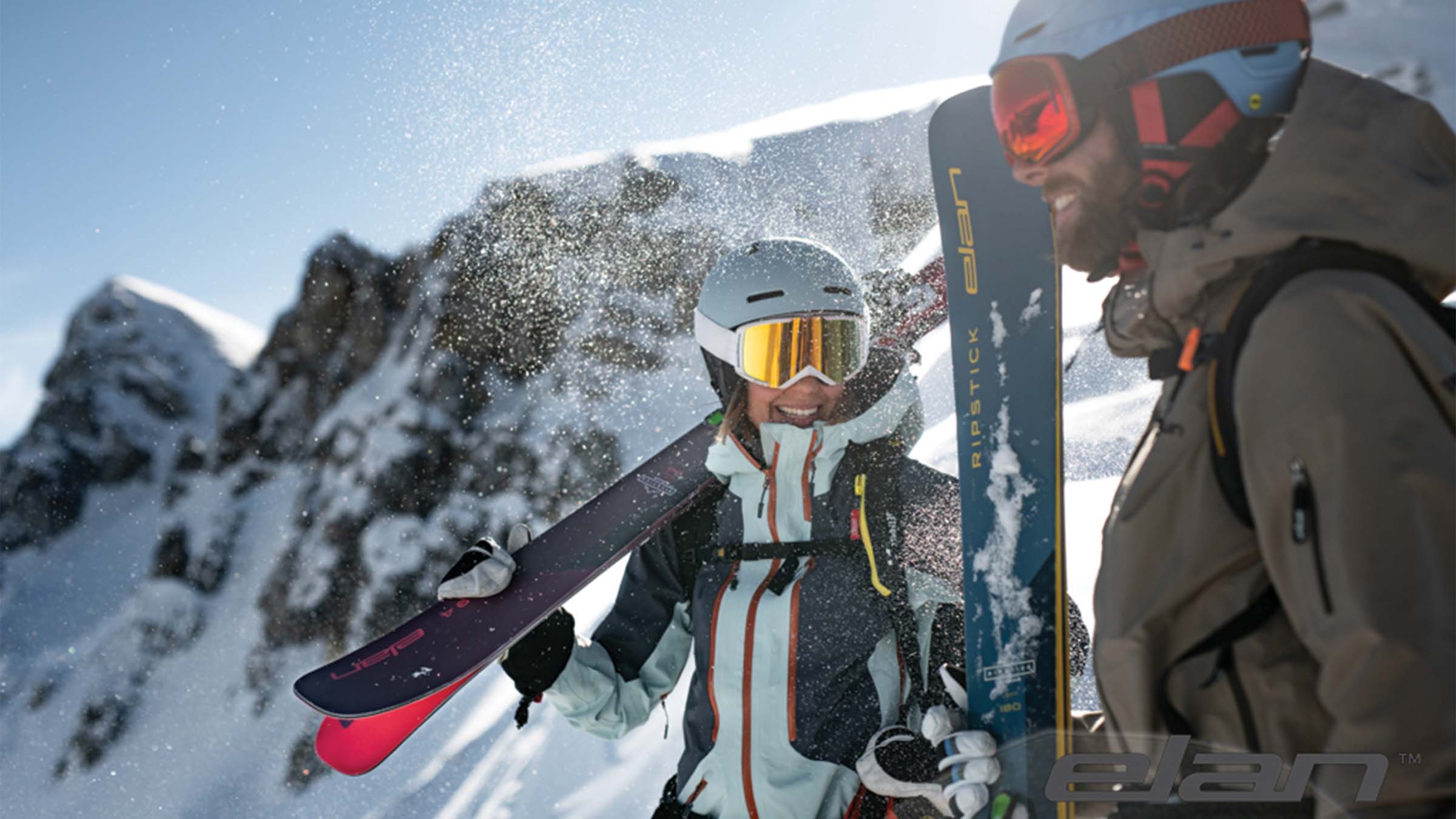 Two Skiers chatting and holding Elan skis