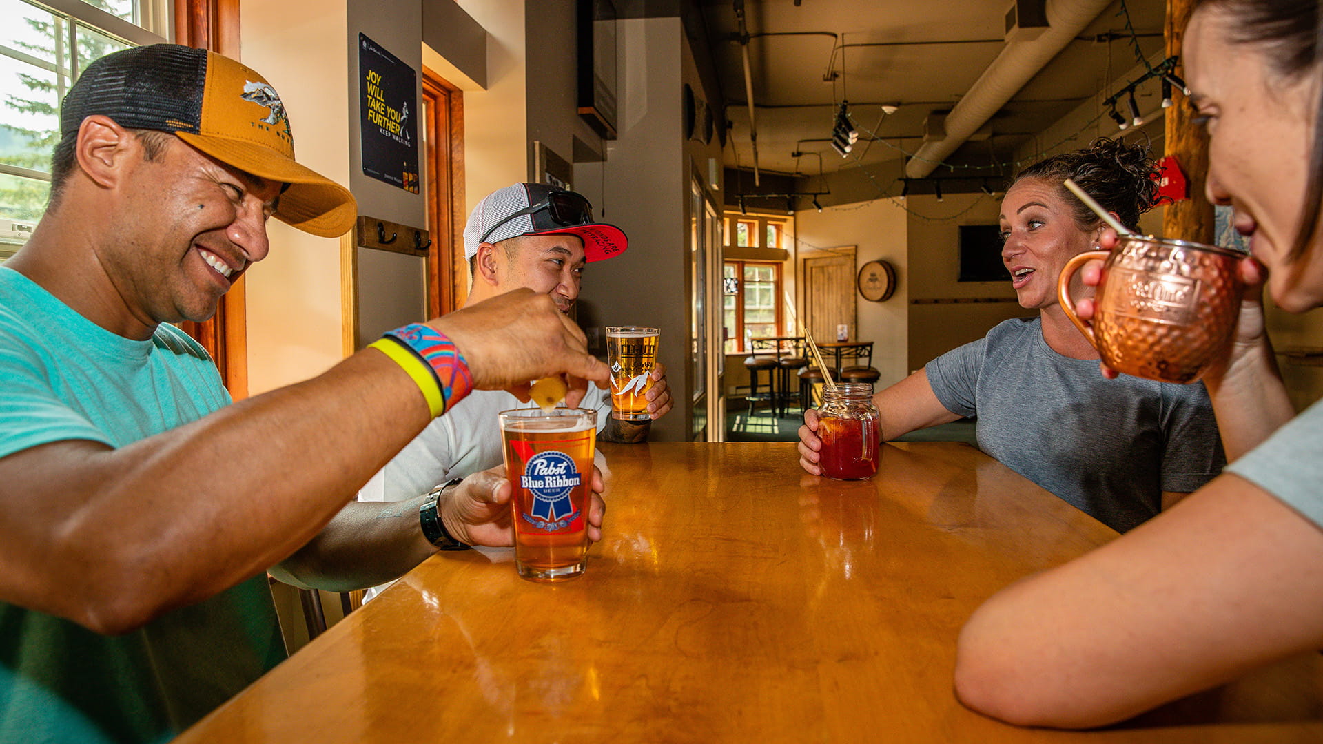 Friends enjoying drinks at The Thirsty Squirrel at Solitude Mountain Resort