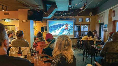Guests at The Thirsty Squirrel watching a ski movie