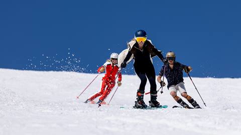 Three friends spring skiing at Solitude Mountain Resort