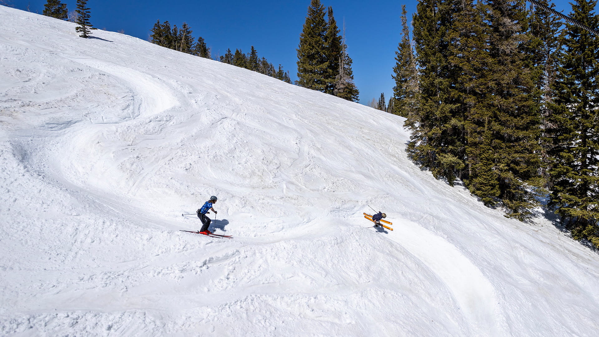 Two skiers skiing in the wiggle at Solitude Mountain Resort