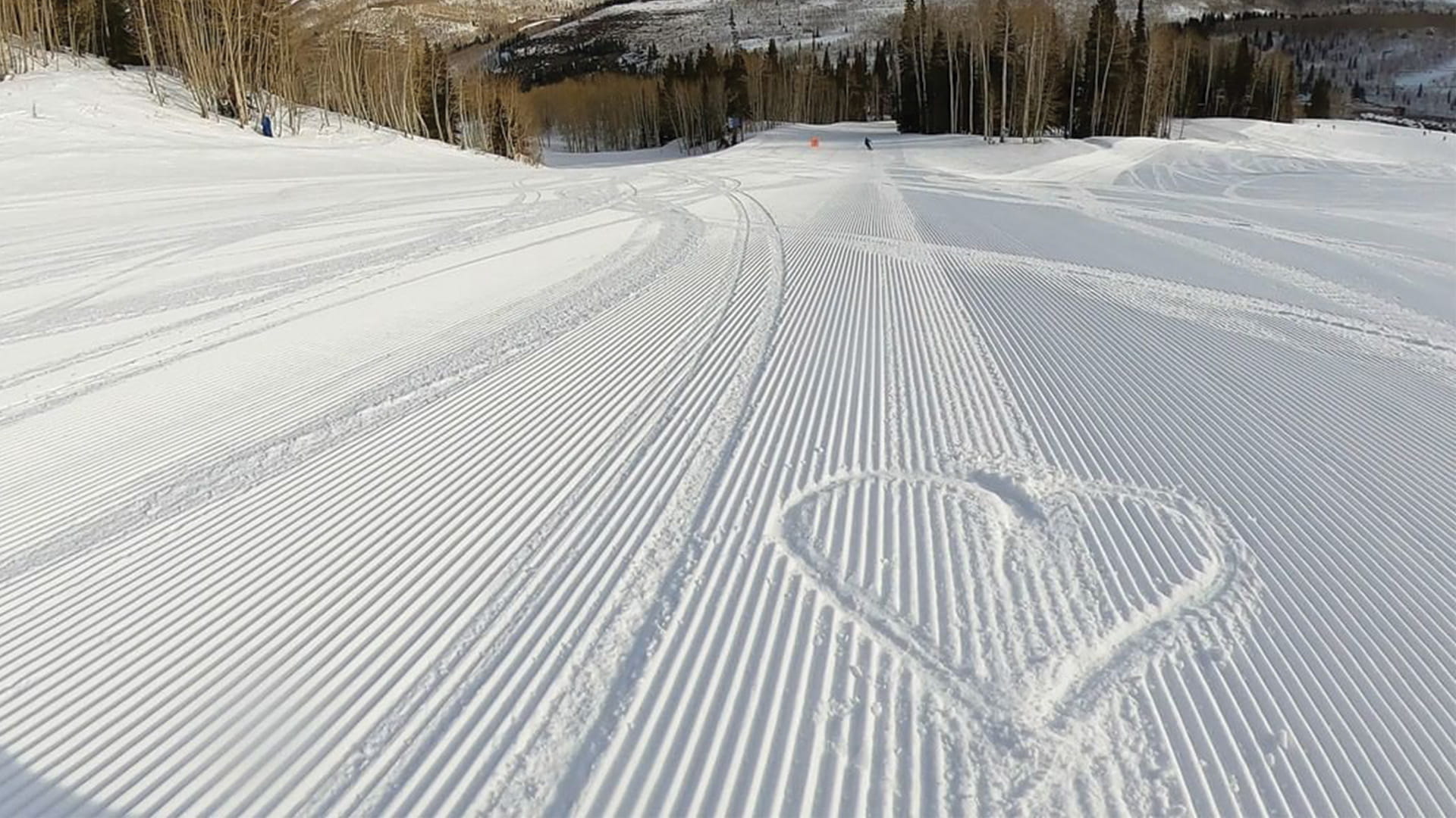 Heart in the snow on a Groomer