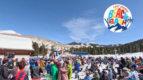 Guests enjoying Last Chance Beach Bash at Solitude Mountain Resort with Apex Express in the background