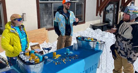 A guest samples a non-alcoholic beer from Athletic Brewing Company at Solitude Mountain Resort