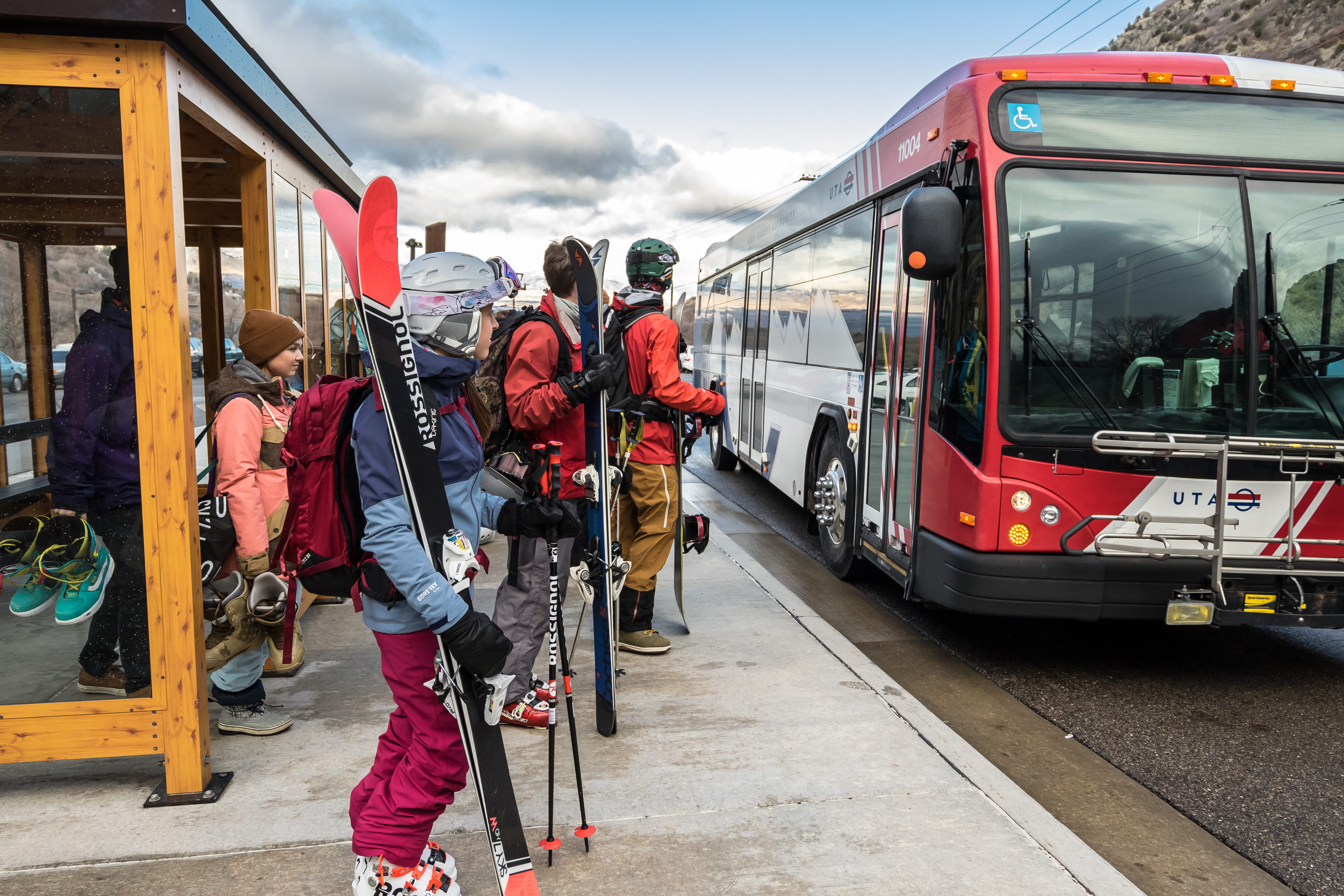 Skiers and boarders loading the UTA Ski Bus at the bottom of the canyon
