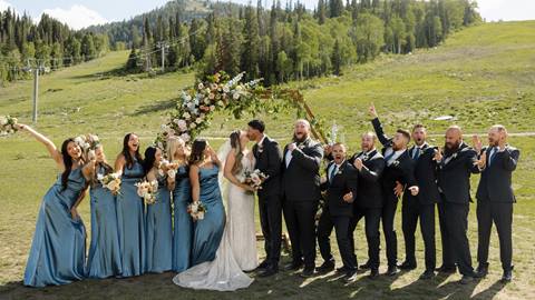 Wedding party in front of a beautiful summer landscape at Solitude Mountain Resort