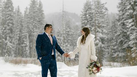 Newlyweds enjoy the natural outdoor beauty of a winter wedding at Solitude