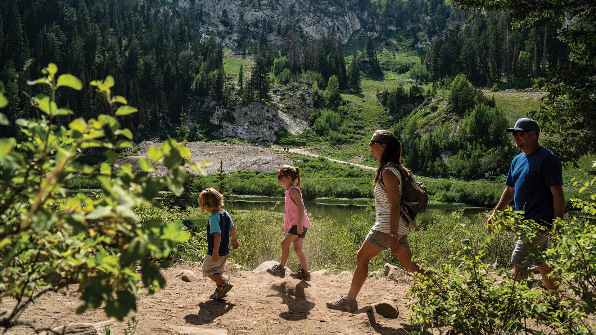 Family hiking near a lake at Solitude Mountain 