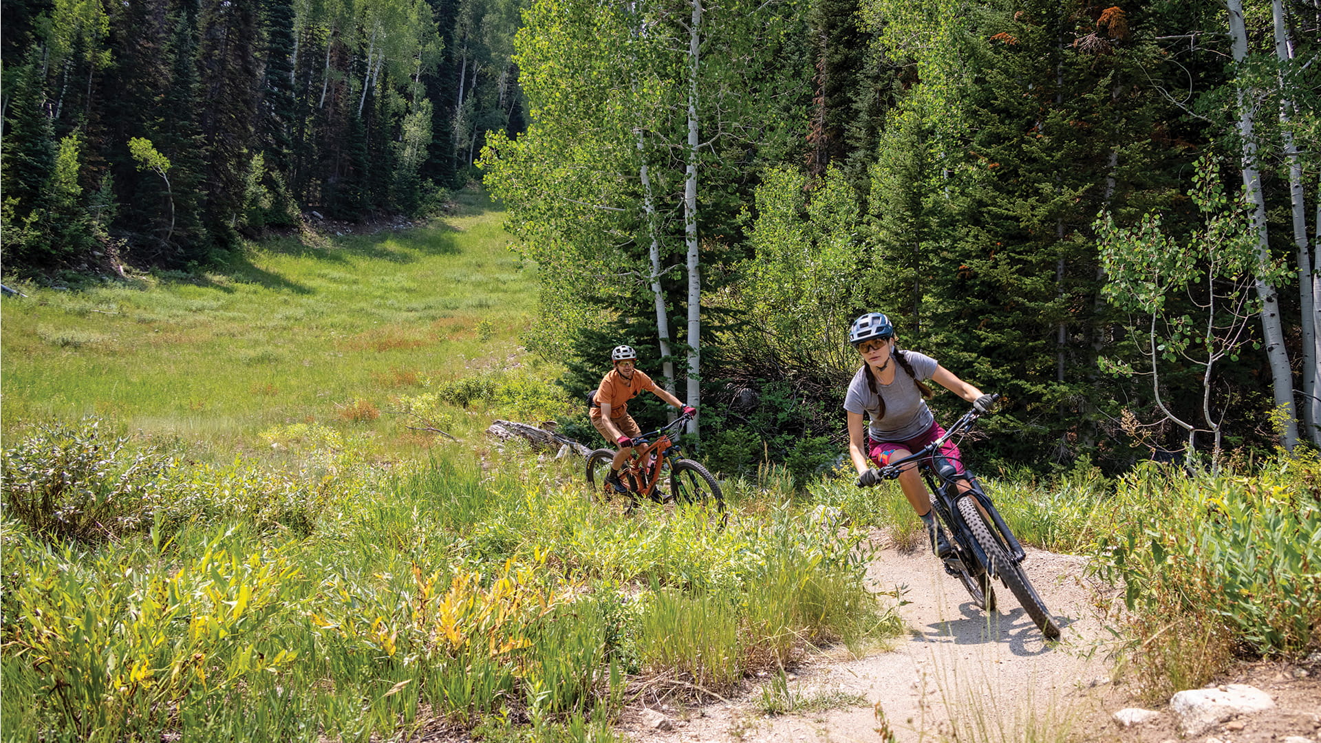 Two people mountain biking on Solitude bike trails