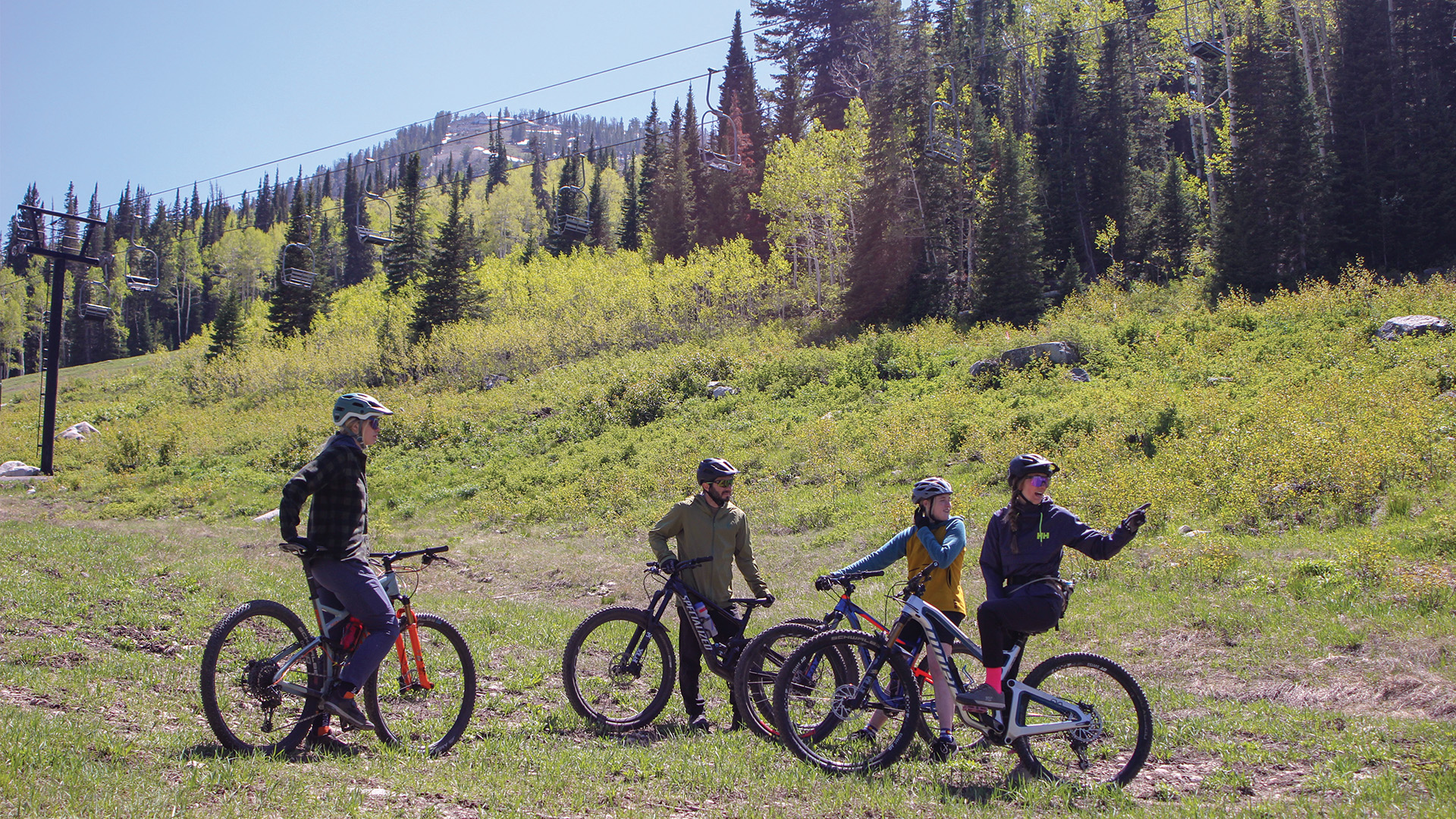 Bike lesson instructor debriefing with group