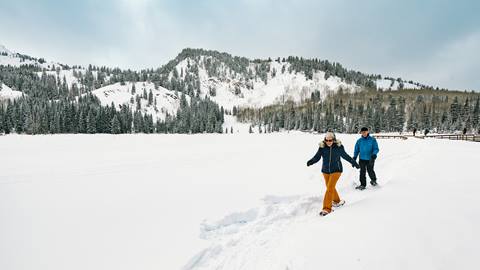 A couple snowshoeing at Solitude Mountain Resort