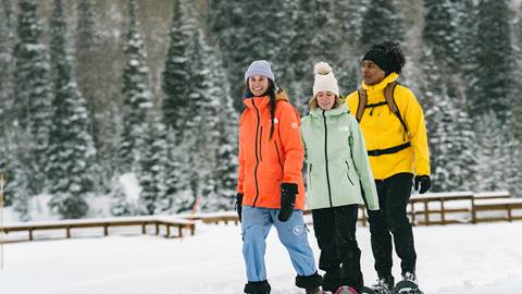 Three friends snowshoeing at the Solitude Nordic & Snowshoe Center