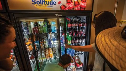 A group of friend selecting beverages at the Village Store