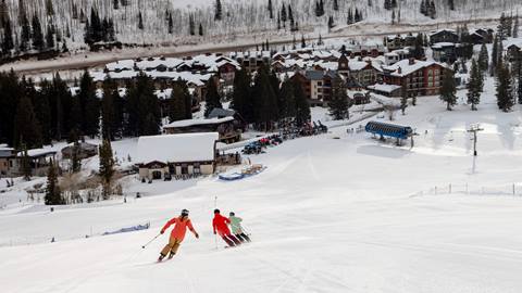Three friends ski to Apex Express at Solitude Mountain Resort