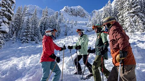 Family chatting while skiing Honeycomb Canyon at Solitude Mountain Resort