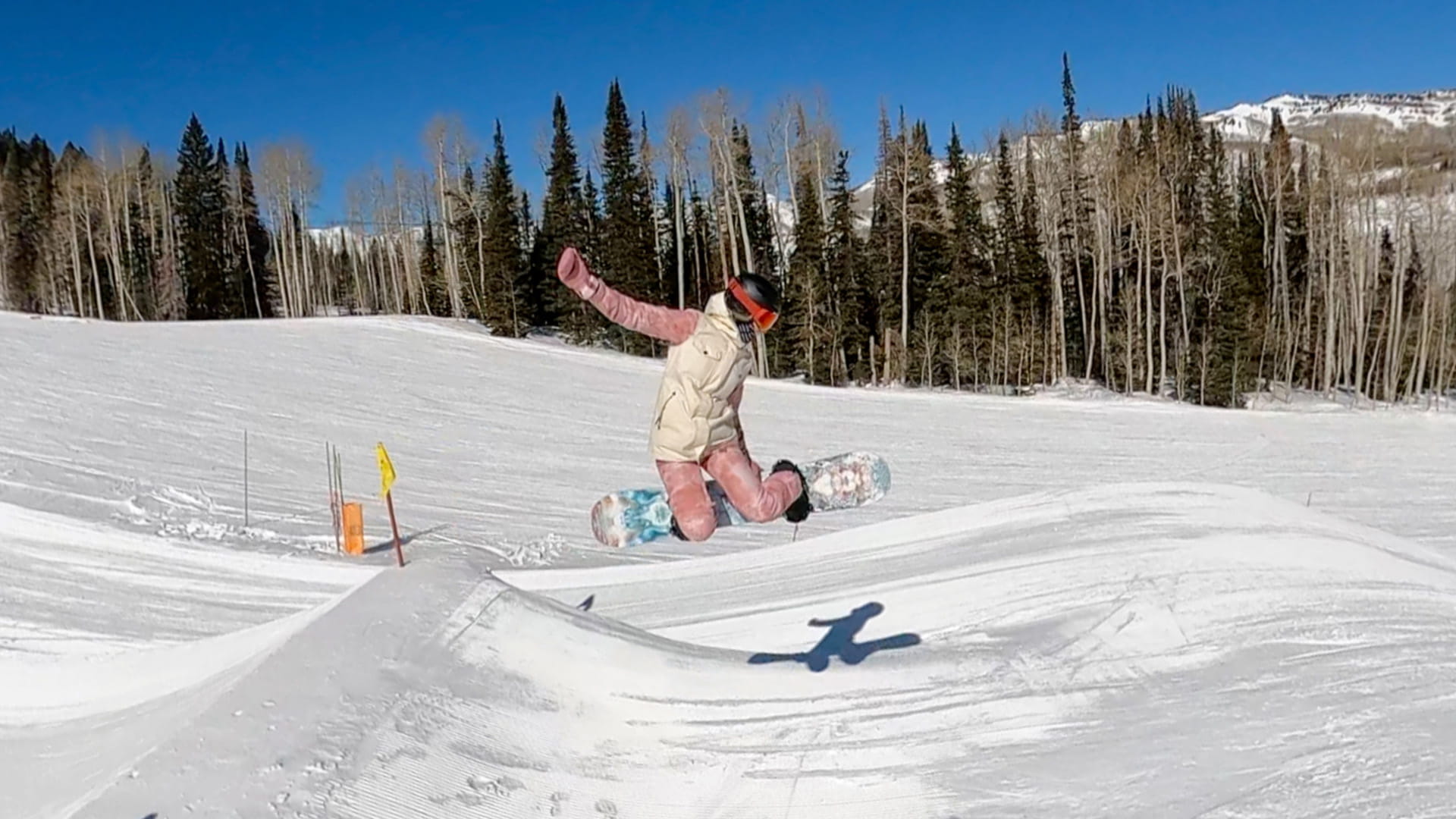 Female rider hitting a jump in the Solitude Terrain Park