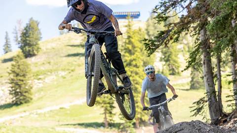 Mountain bikers jumping on Quicksilver at Solitude Bike Park