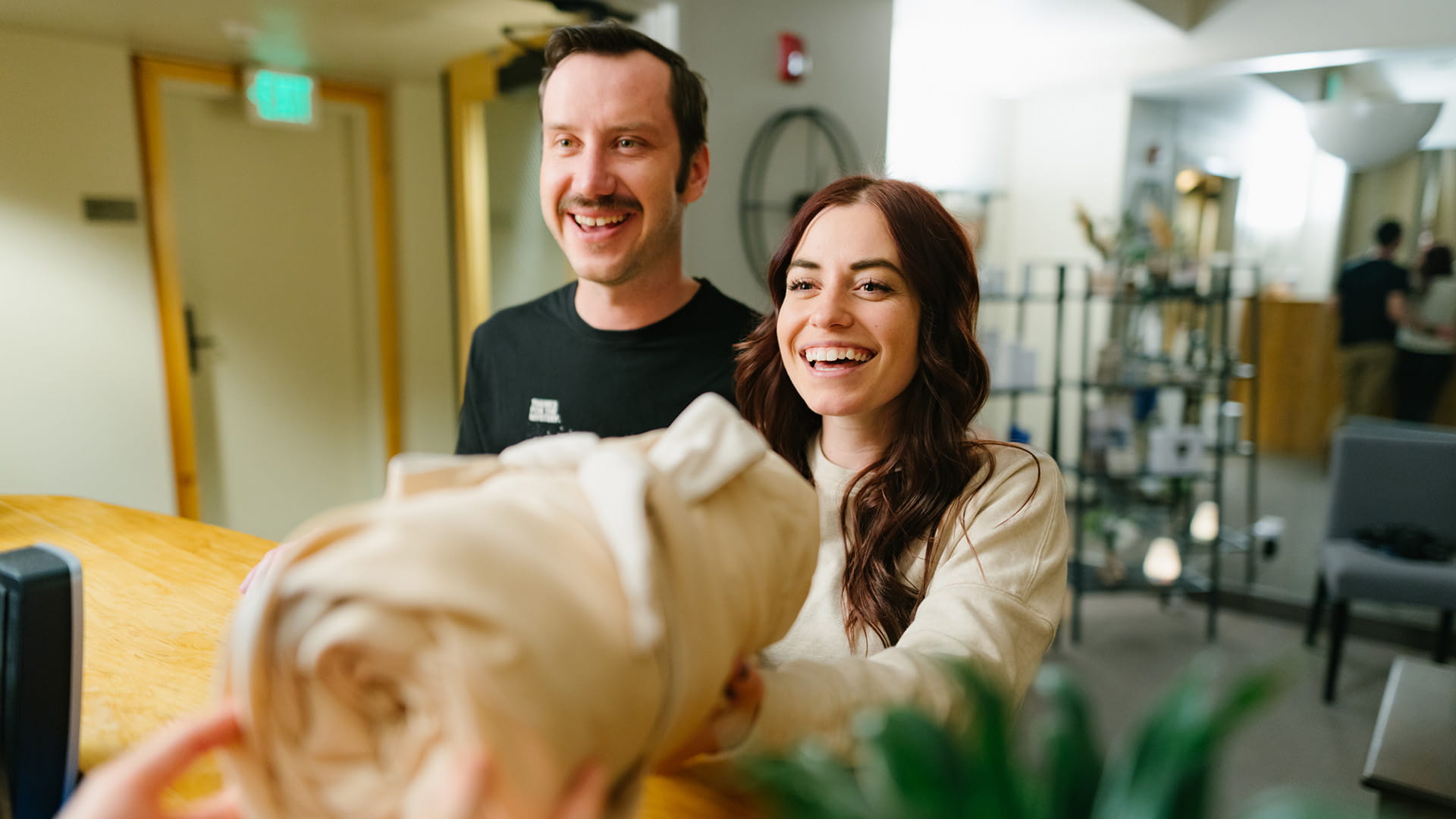 A couple getting towels at Solitude Mountain Spa 