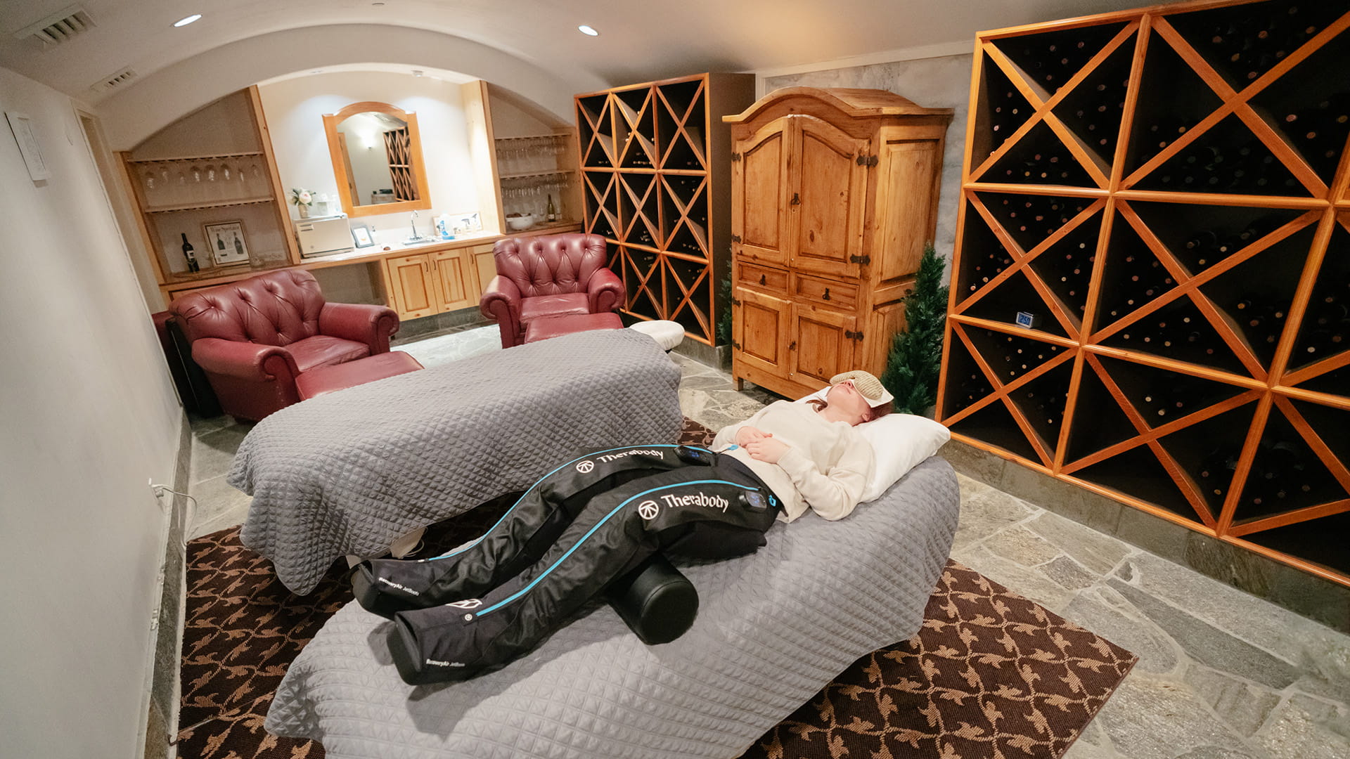 Guest using Thereabody boots at Solitude Mountain Spa