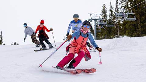 Friends skiing and riding on a spring day at Solitude