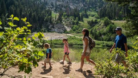 Family hiking at Lake Solitude
