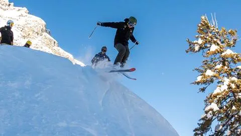 A member of the Big Mountain Team at Solitude Mountain Resort catches big air off a jump