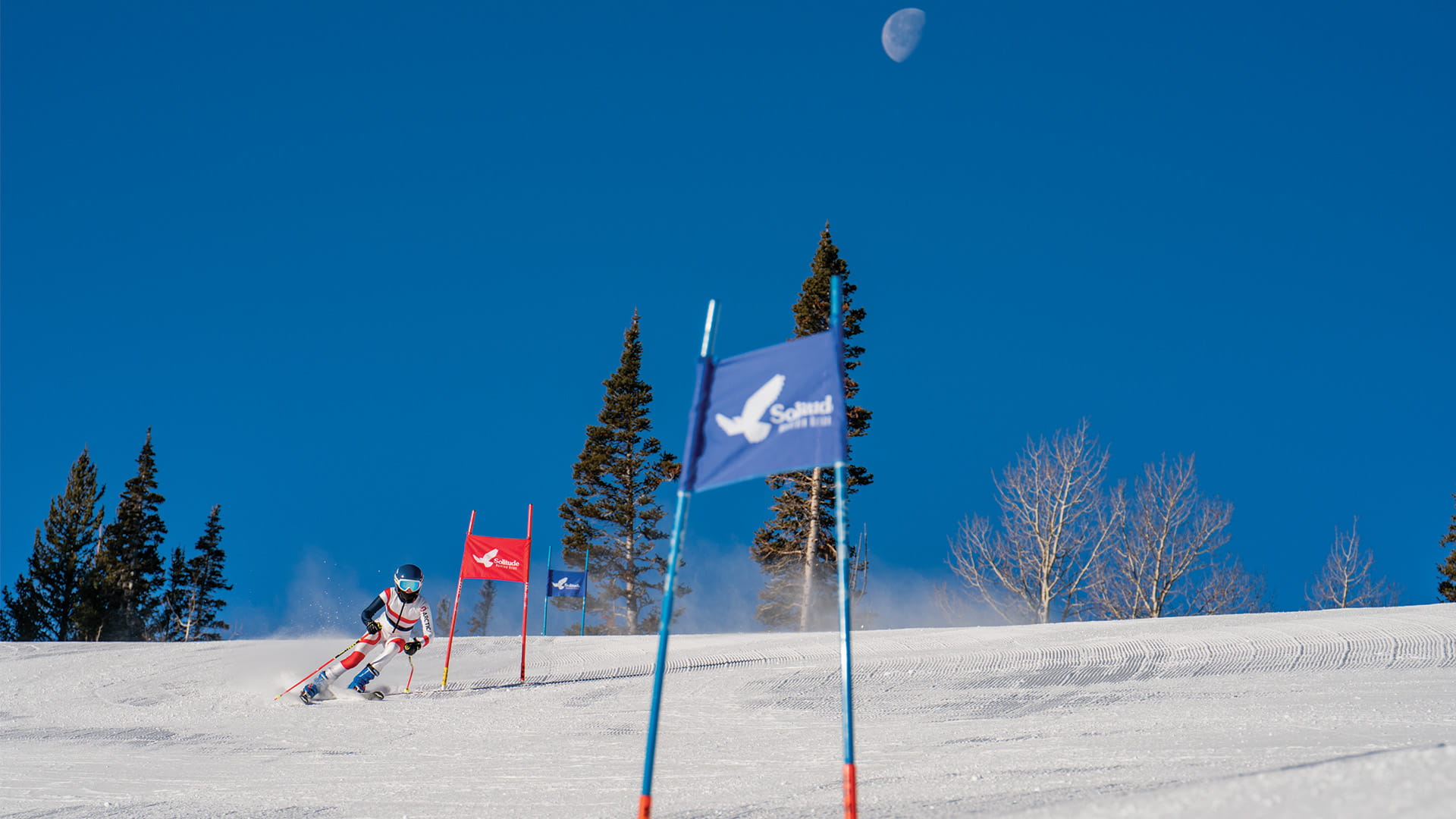 A junior racer trains on the Super G ski racing course at Solitude Mountain Resort