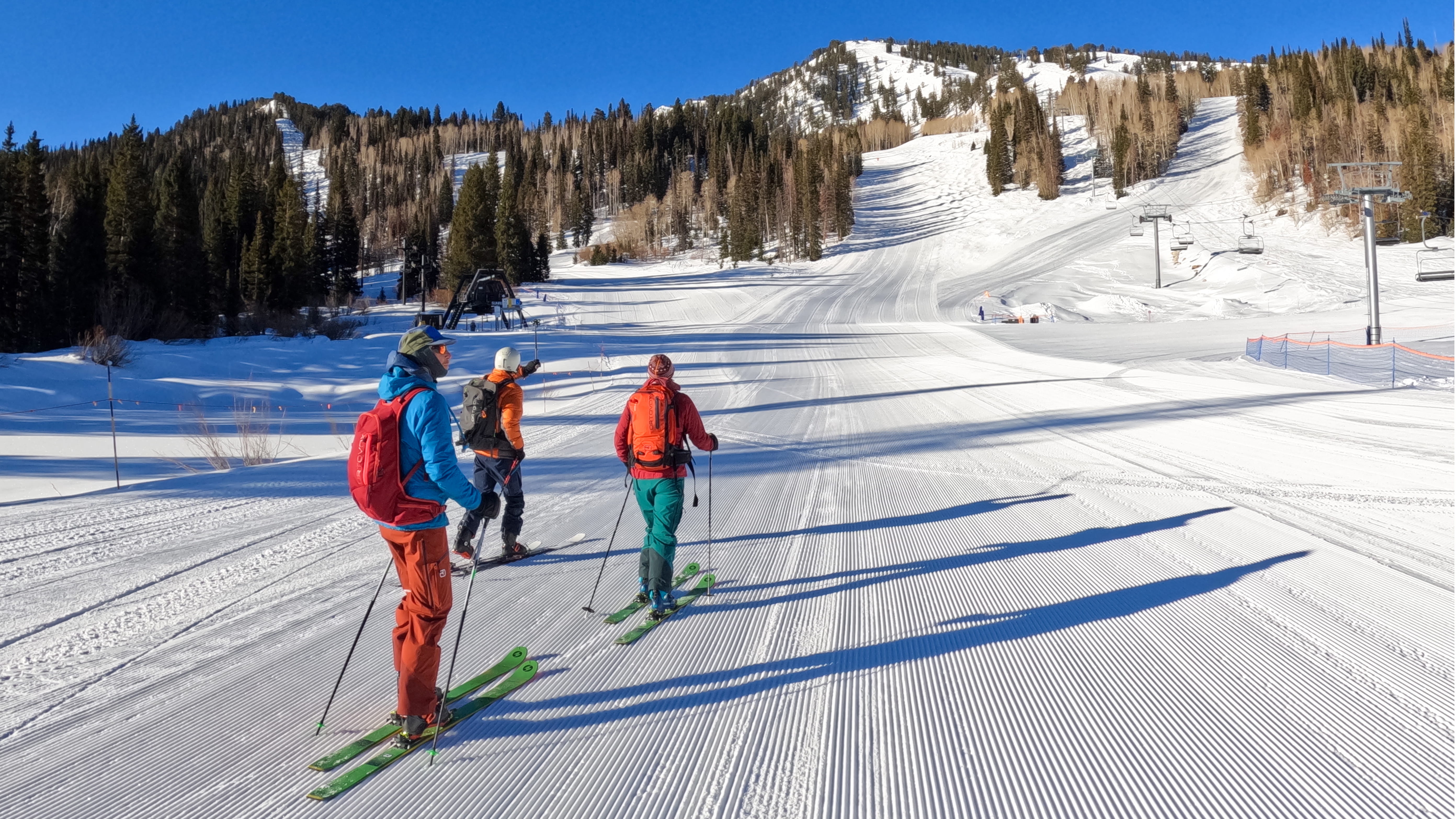 uphill skiers at sunrise lift 