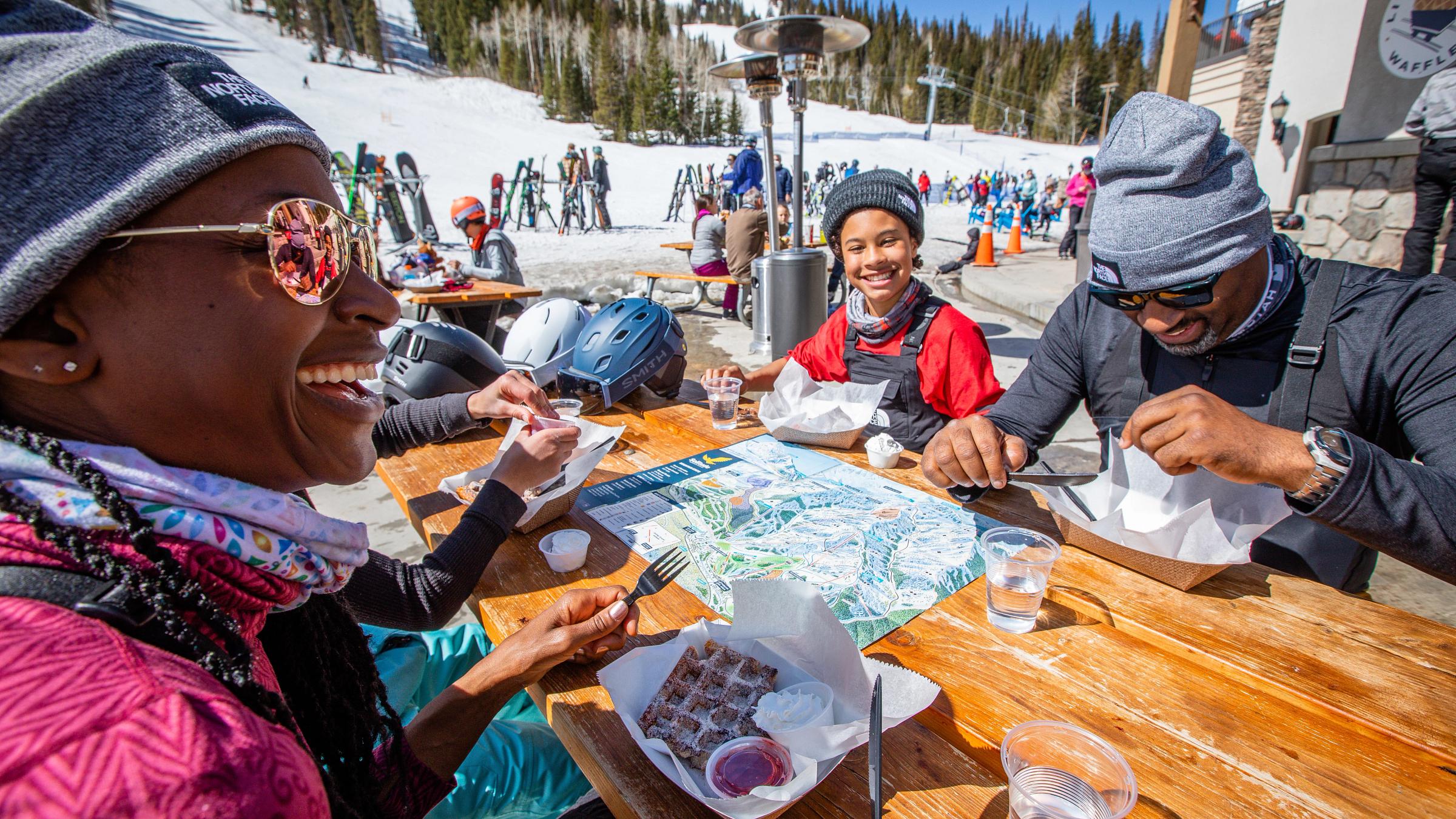 A family enjoys Little Dollie Waffles at Solitude Mountain Resort