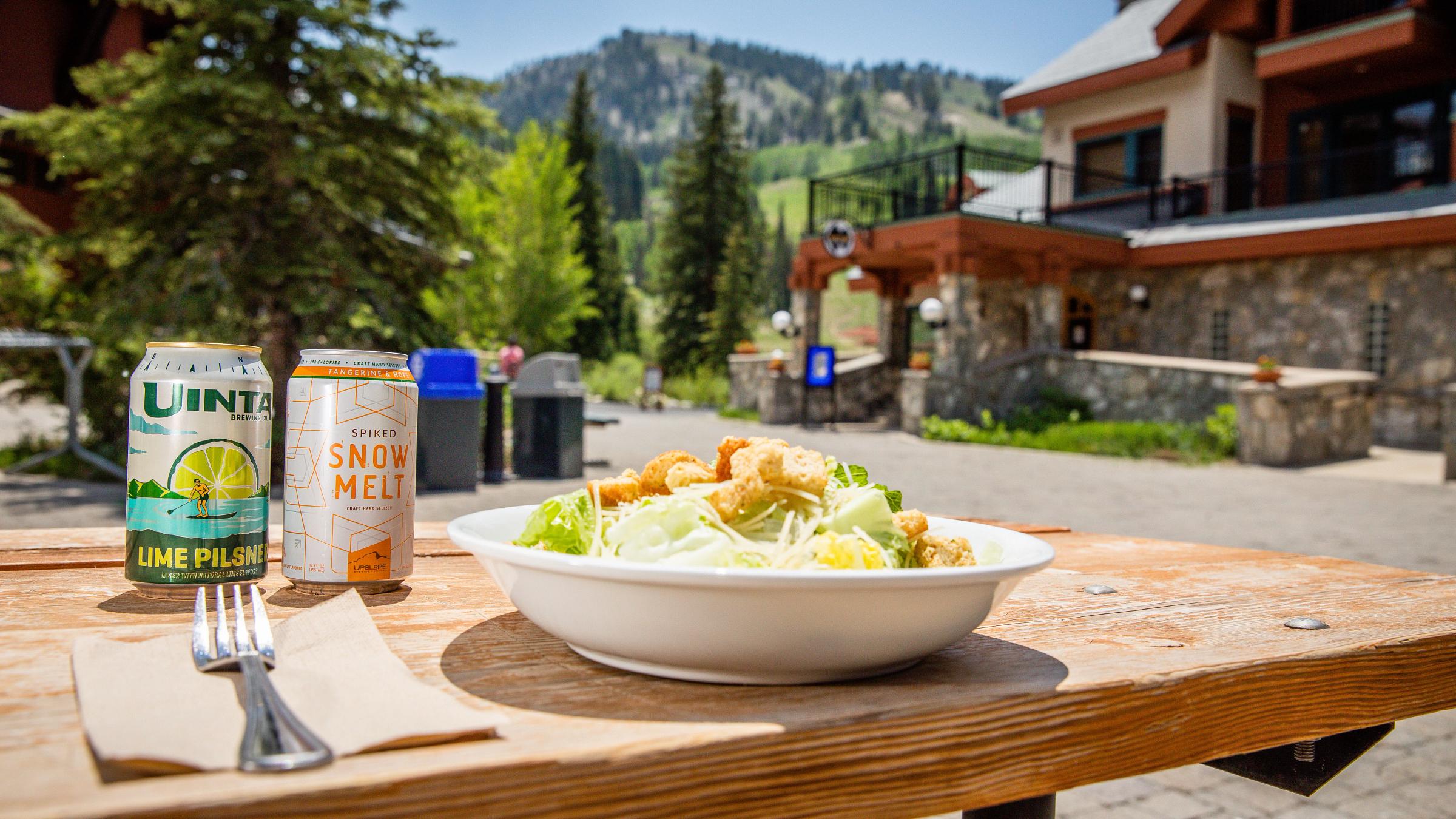 A Caesar salad with beverages from Stone Haus Pizzeria & Creamery at Solitude Mountain Resort