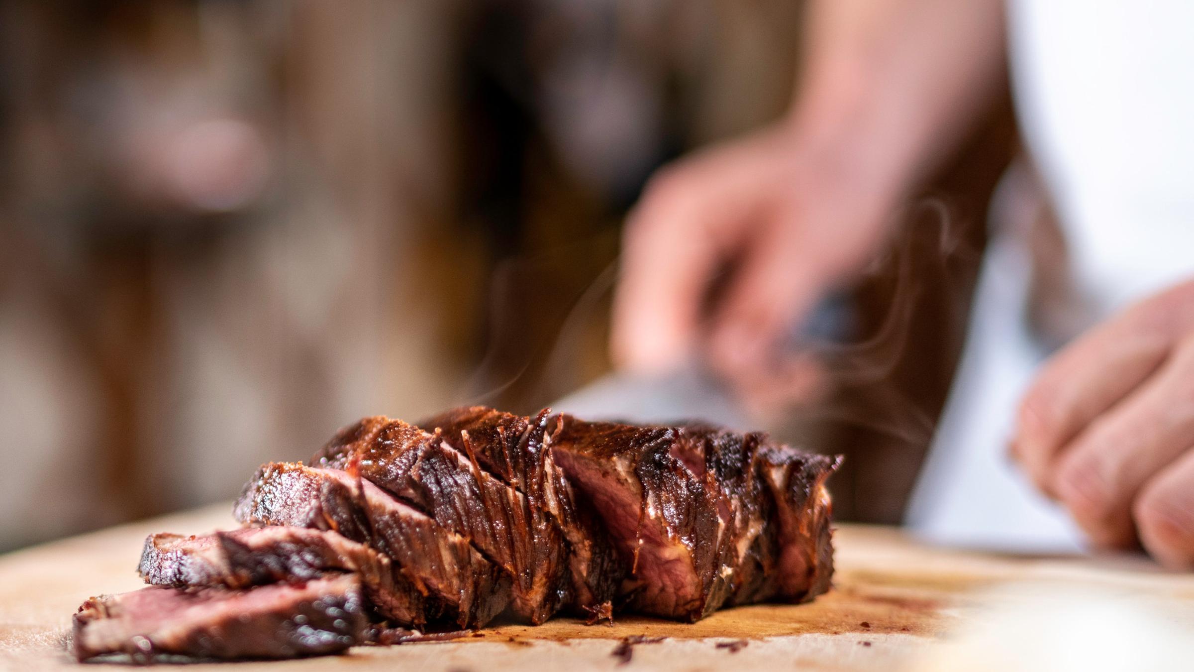 Chef Preparing Meat at The Yurt