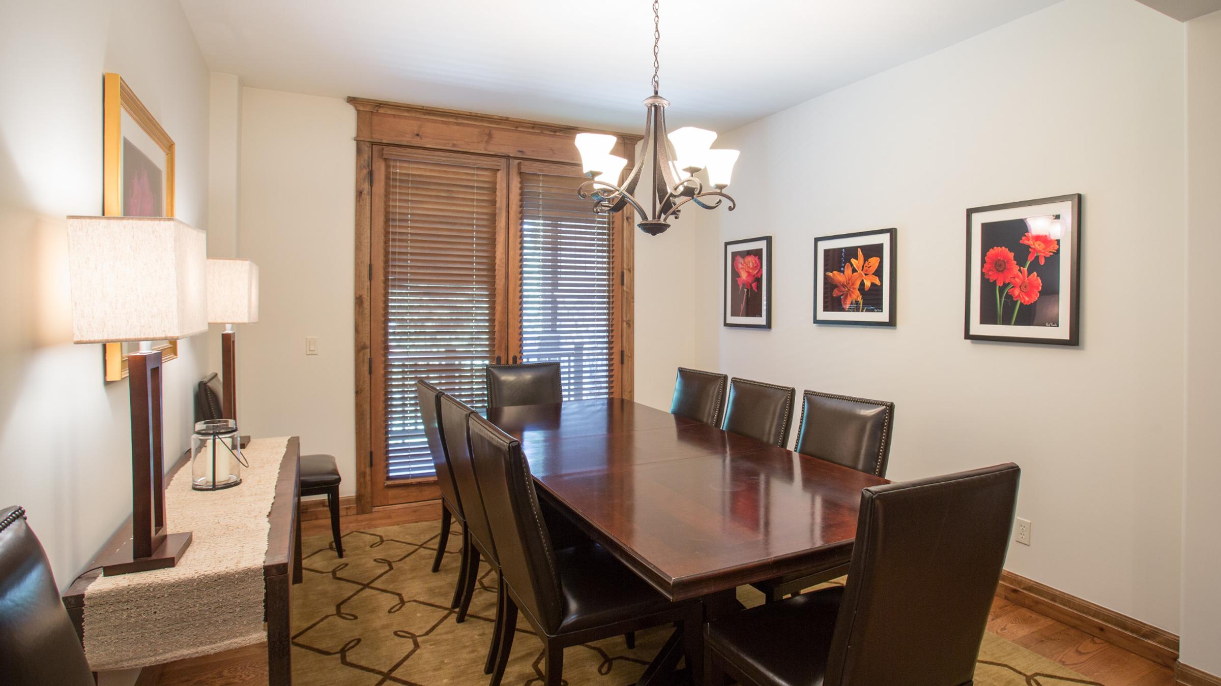 Dining room table with chairs and side table
