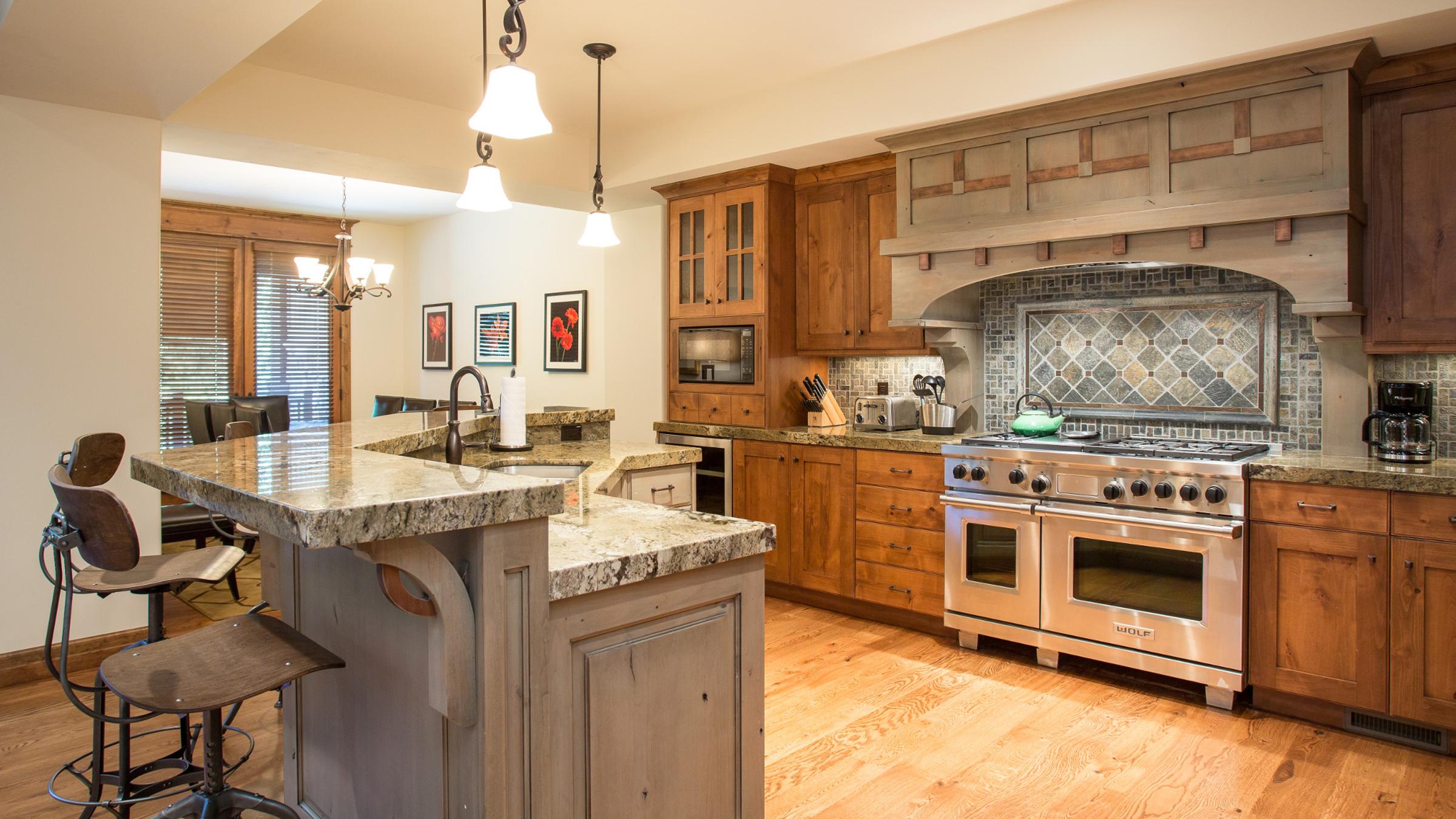 Large kitchen with breakfast bar and appliances