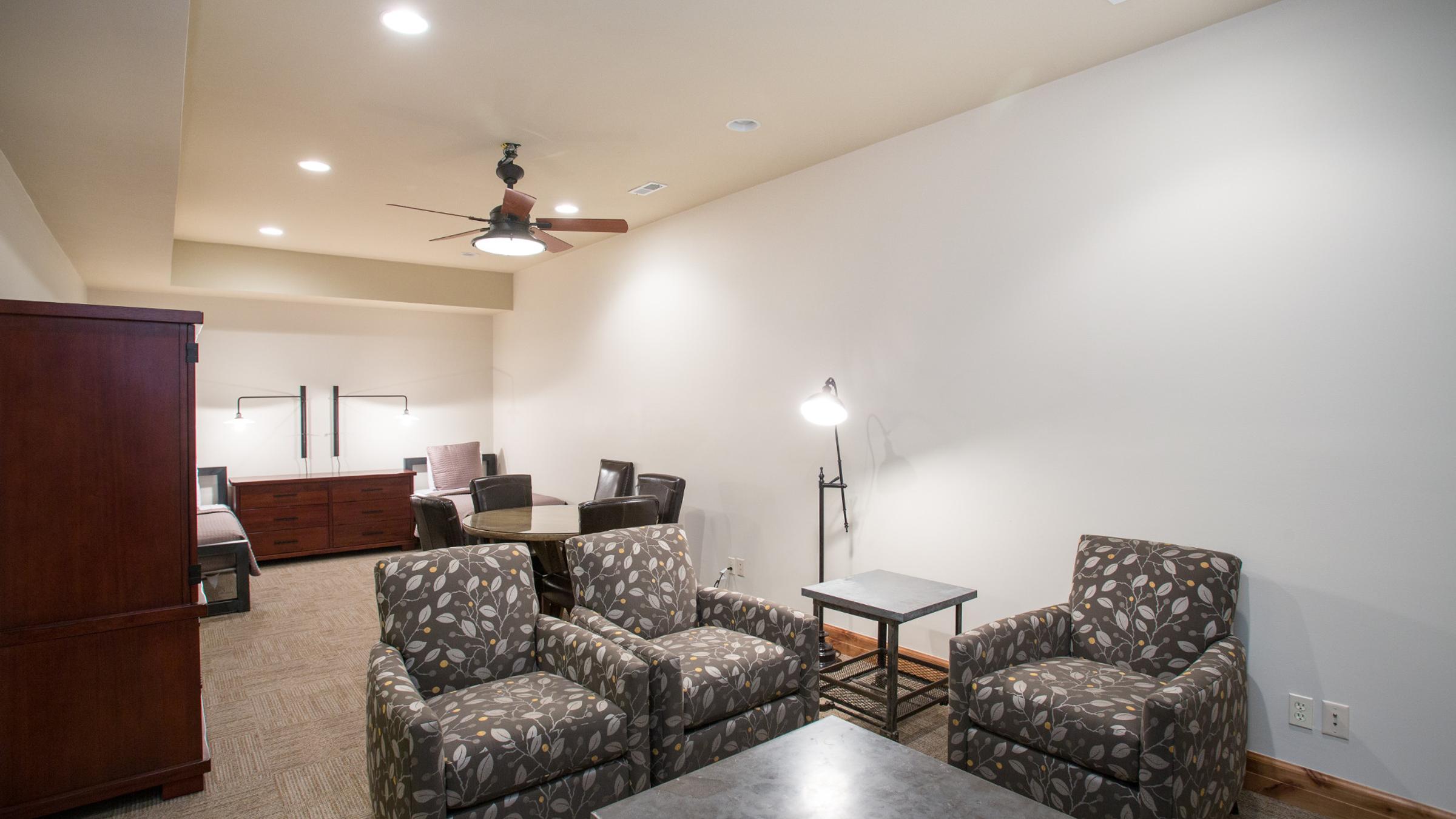 Sofa chairs and coffee table and two twin beds