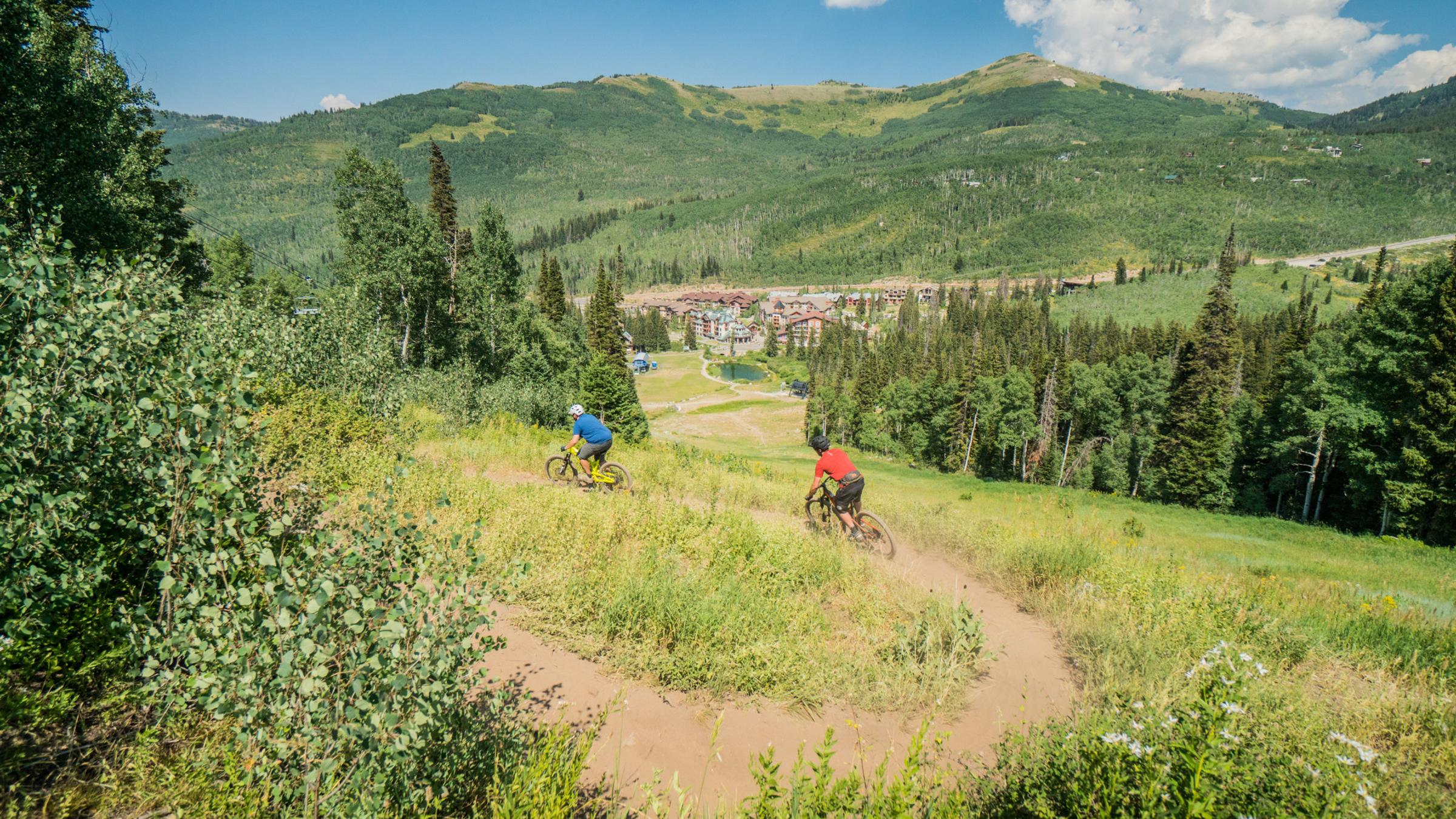 Mountain Biking on Solitude trails with Solitude Village in the distance