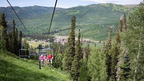 Family riding up on a chairlift for a scenic ride